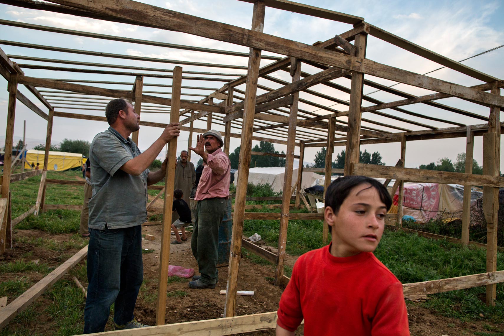 Refugees Build Shelter | Andrew McConnell - Photographer